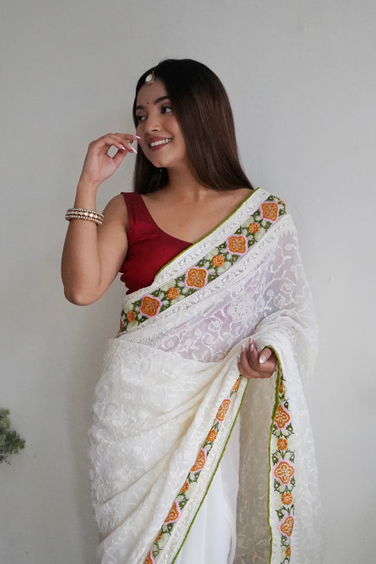 Off White Georgette Saree with Red Blouse Piece Off White Georgette Saree with Red Blouse Piece