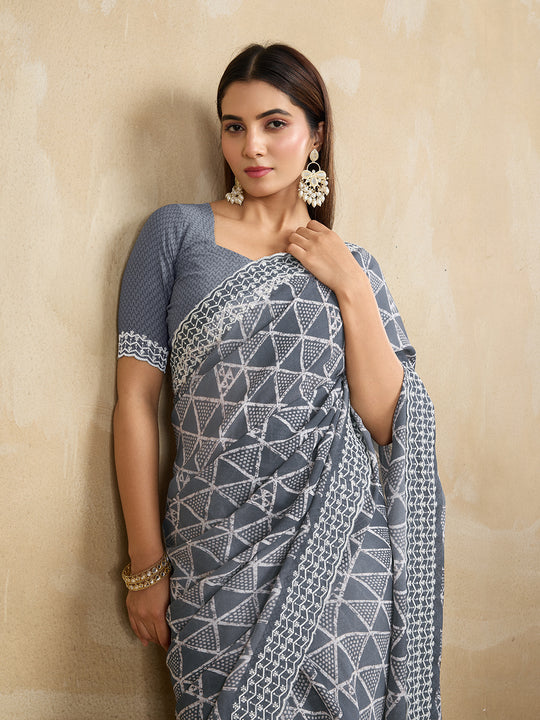 Poly Georgette Geometric Printed Saree With Embroidered Border And Blouse Piece