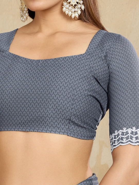 Poly Georgette Geometric Printed Saree With Embroidered Border And Blouse Piece