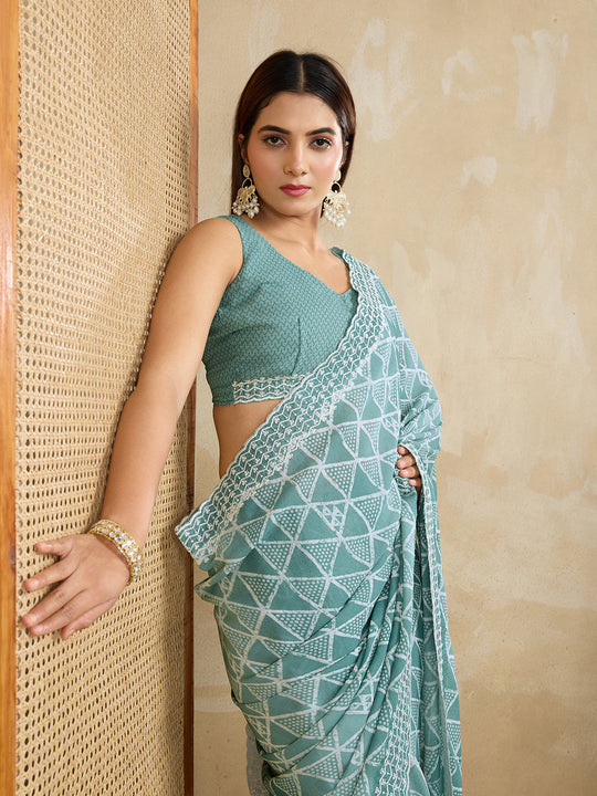 Poly Georgette Geometric Printed Saree With Embroidered Border And Blouse Piece