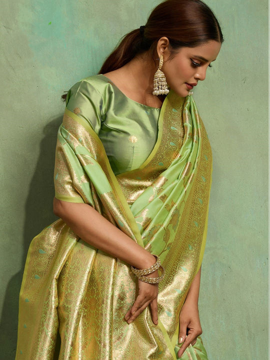 Dual Tone Banarasi Silk With Golden Zari Woven In Iconic Banarasi Jaal Pattern With Meenakari Hues Throughout Attached Dual Color Jhallar With Fumka