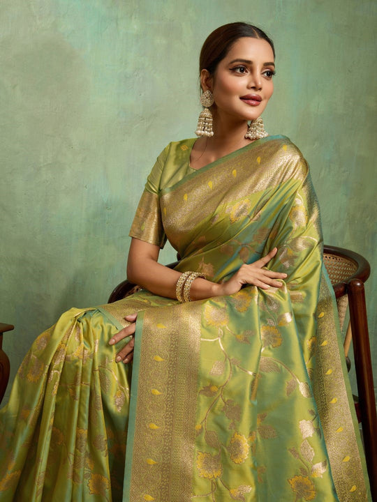 Dual Tone Banarasi Silk With Golden Zari Woven In Iconic Banarasi Jaal Pattern With Meenakari Hues Throughout Attached Dual Color Jhallar With Fumka