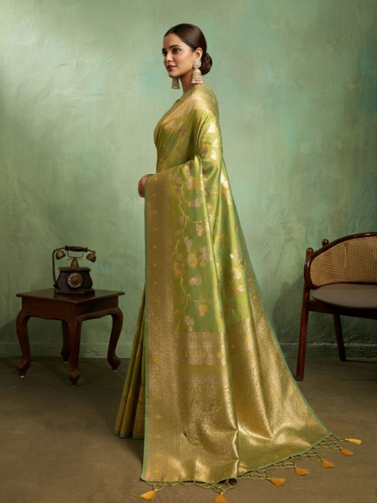 Dual Tone Banarasi Silk With Golden Zari Woven In Iconic Banarasi Jaal Pattern With Meenakari Hues Throughout Attached Dual Color Jhallar With Fumka