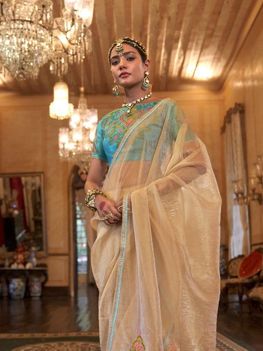 Gold Tissue Fabric With Multi Thread Embroidery Work And Lace Border Details.