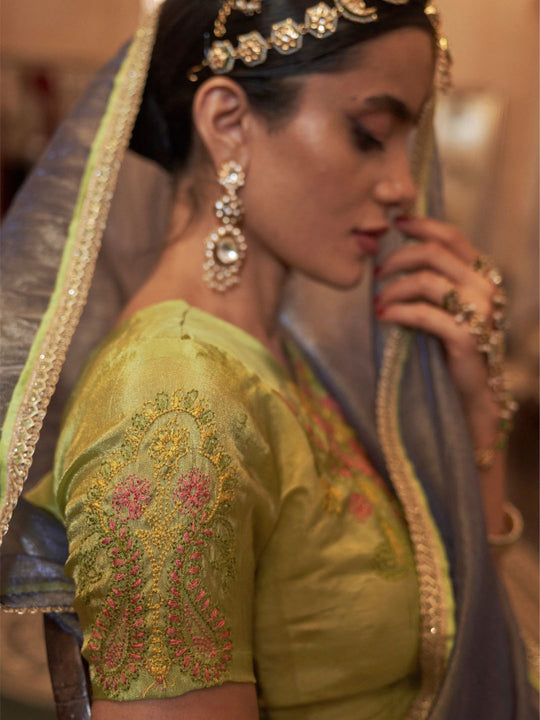 Gold Tissue Fabric With Multi Thread Embroidery Work And Lace Border Details.
