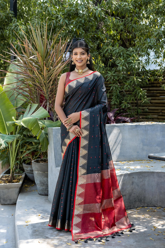Black Semi Tussar Silk Saree With All Over Bandhani Style Butti Weaves And Very Well Designed Traditional Temple Border With Zari Linning Pallu And Blouse Piece