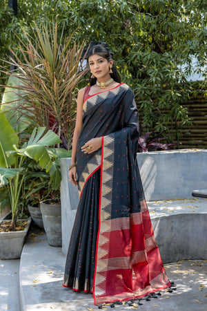 Black Semi Tussar Silk Saree With All Over Bandhani Style Butti Weaves And Very Well Designed Traditional Temple Border With Zari Linning Pallu And Blouse Piece