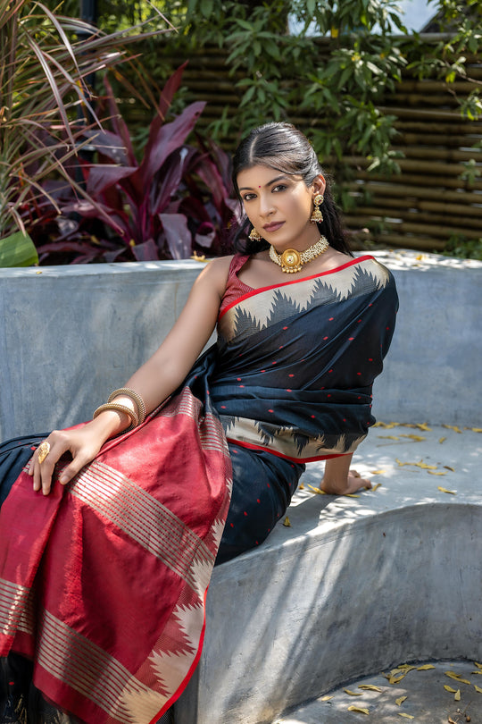 Black Semi Tussar Silk Saree With All Over Bandhani Style Butti Weaves And Very Well Designed Traditional Temple Border With Zari Linning Pallu And Blouse Piece