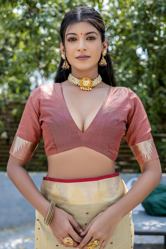 Cream Semi Tussar Silk Saree With All Over Bandhani Style Butti Weaves And Very Well Designed Traditional Temple Border With Zari Linning Pallu And Blouse Piece