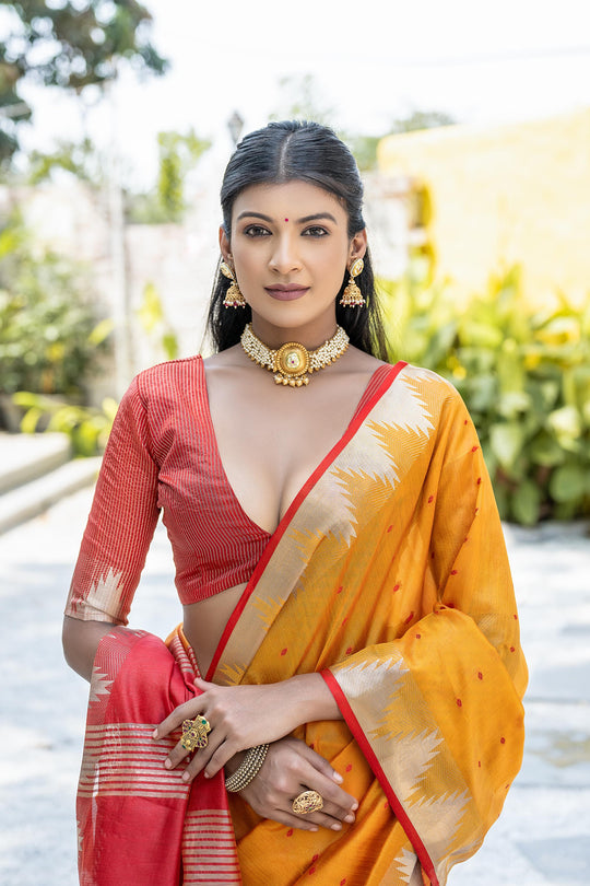 Orange Semi Tussar Silk Saree With All Over Bandhani Style Butti Weaves And Very Well Designed Traditional Temple Border With Zari Linning Pallu And Blouse Piece