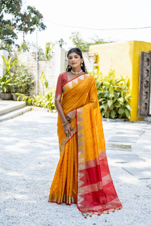 Orange Semi Tussar Silk Saree With All Over Bandhani Style Butti Weaves And Very Well Designed Traditional Temple Border With Zari Linning Pallu And Blouse Piece