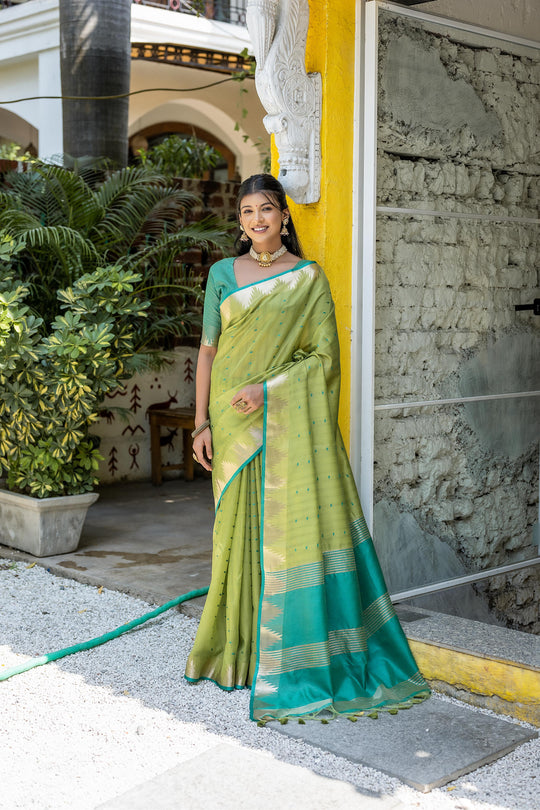 Green Semi Tussar Silk Saree With All Over Bandhani Style Butti Weaves And Very Well Designed Traditional Temple Border With Zari Linning Pallu And Blouse Piece