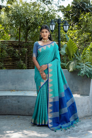 Blue Semi Tussar Silk Saree With All Over Bandhani Style Butti Weaves And Very Well Designed Traditional Temple Border With Zari Linning Pallu And Blouse Piece