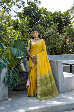 Yellow Semi Tussar Silk Saree With All Over Bandhani Style Butti Weaves And Very Well Designed Traditional Temple Border With Zari Linning Pallu And Blouse Piece