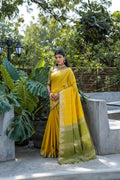 Yellow Semi Tussar Silk Saree With All Over Bandhani Style Butti Weaves And Very Well Designed Traditional Temple Border With Zari Linning Pallu And Blouse Piece