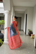 Grey & Red Soft Desi Tussar Silk Saree With Unique Ikkat Painted Pattern With Tradional Ikkat Pallu And Border With Traditional Tassels And Contrast Blouse Piece