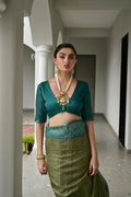 Green  Soft Desi Tussar Silk Saree With Unique Ikkat Painted Pattern With Tradional Ikkat Pallu And Border With Traditional Tassels And Contrast Blouse Piece