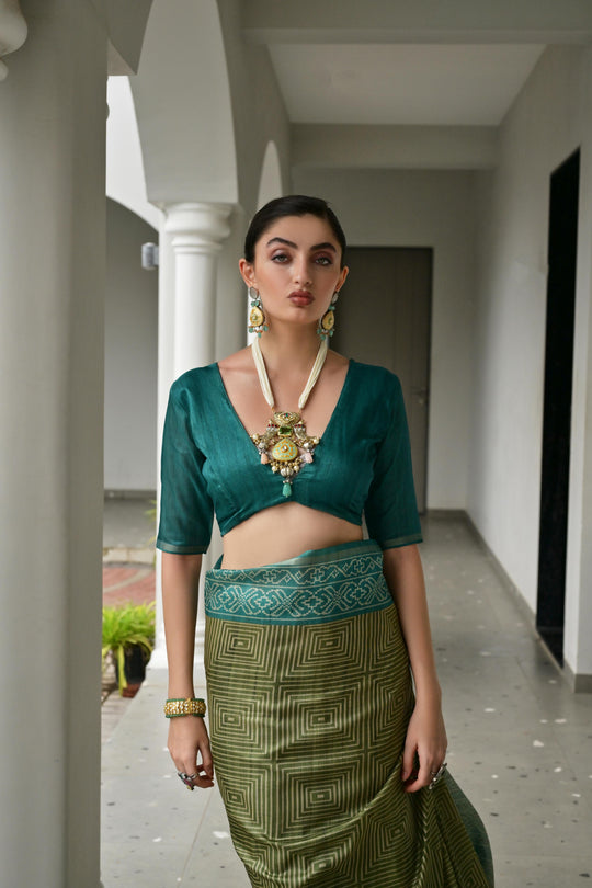 Green  Soft Desi Tussar Silk Saree With Unique Ikkat Painted Pattern With Tradional Ikkat Pallu And Border With Traditional Tassels And Contrast Blouse Piece