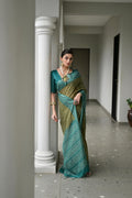 Green  Soft Desi Tussar Silk Saree With Unique Ikkat Painted Pattern With Tradional Ikkat Pallu And Border With Traditional Tassels And Contrast Blouse Piece