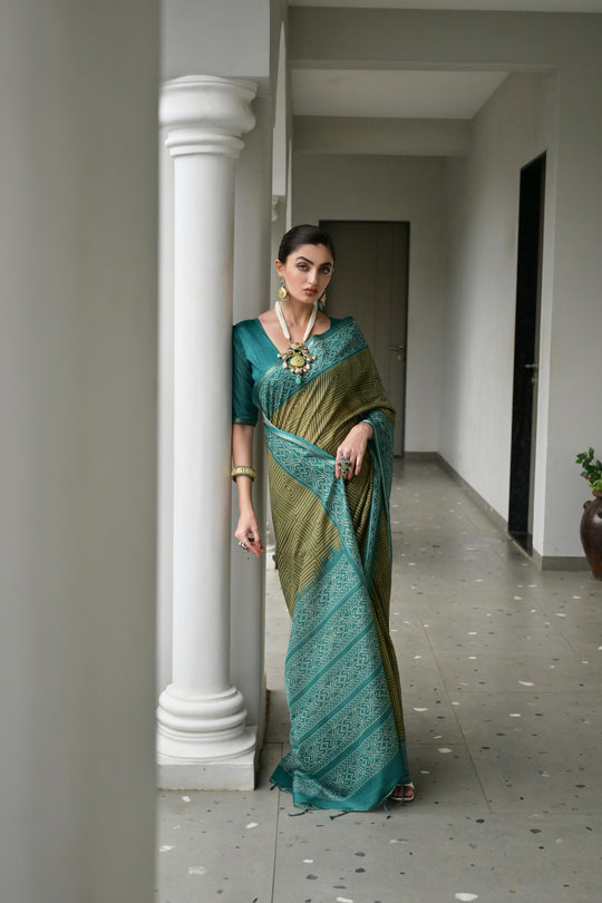 Green  Soft Desi Tussar Silk Saree With Unique Ikkat Painted Pattern With Tradional Ikkat Pallu And Border With Traditional Tassels And Contrast Blouse Piece
