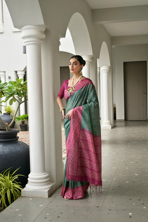 Green & Pink Soft Desi Tussar Silk Saree With Unique Ikkat Painted Pattern With Tradional Ikkat Pallu And Border With Traditional Tassels And Contrast Blouse Piece