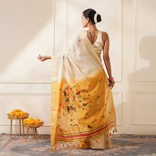 White & Yellow Premium Soft Muga Cotton Saree With Classic Colorful Resham Weaving Pallu And Traditional Zari Weaving Border And All Over Resham Weaving Butties And Fancy Tassels With Contrast Blouse Piece