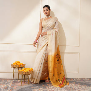White & Yellow Premium Soft Muga Cotton Saree With Classic Colorful Resham Weaving Pallu And Traditional Zari Weaving Border And All Over Resham Weaving Butties And Fancy Tassels With Contrast Blouse Piece