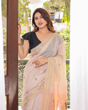 Off White & Peach Premium Soft Muga Cotton Saree With Classic Colorful Resham Weaving Pallu And Traditional Zari Weaving Border And All Over Resham Weaving Butties And Fancy Tassels With Contrast Blouse Piece
