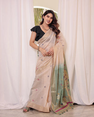 Off White & Green Premium Soft Muga Cotton Saree With Classic Colorful Resham Weaving Pallu And Traditional Zari Weaving Border And All Over Resham Weaving Butties And Fancy Tassels With Contrast Blouse Piece