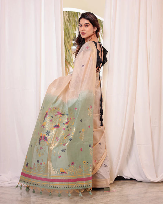 Off White & Green Premium Soft Muga Cotton Saree With Classic Colorful Resham Weaving Pallu And Traditional Zari Weaving Border And All Over Resham Weaving Butties And Fancy Tassels With Contrast Blouse Piece