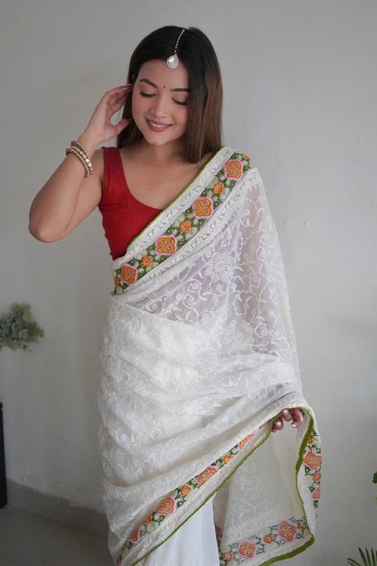 Off White Georgette Saree with Red Blouse Piece