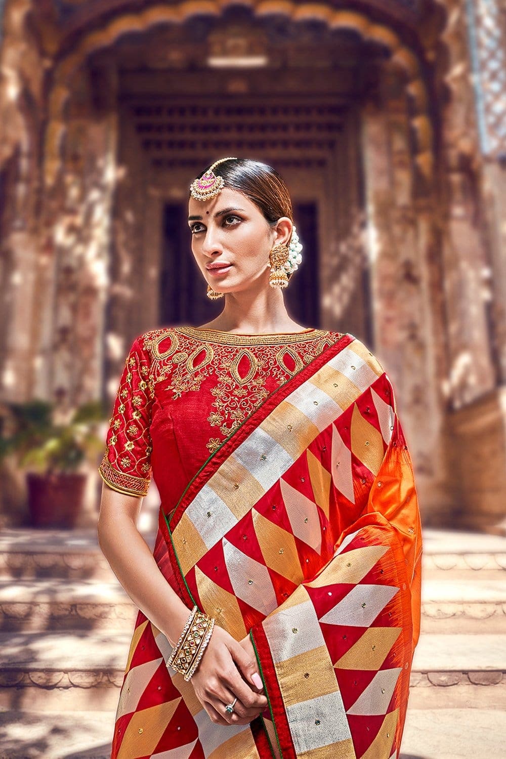 Orange And Red Banarasi Saree With Embroidered Silk Blouse