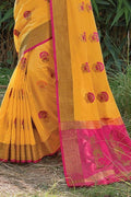 yellow saree with pink pallu 